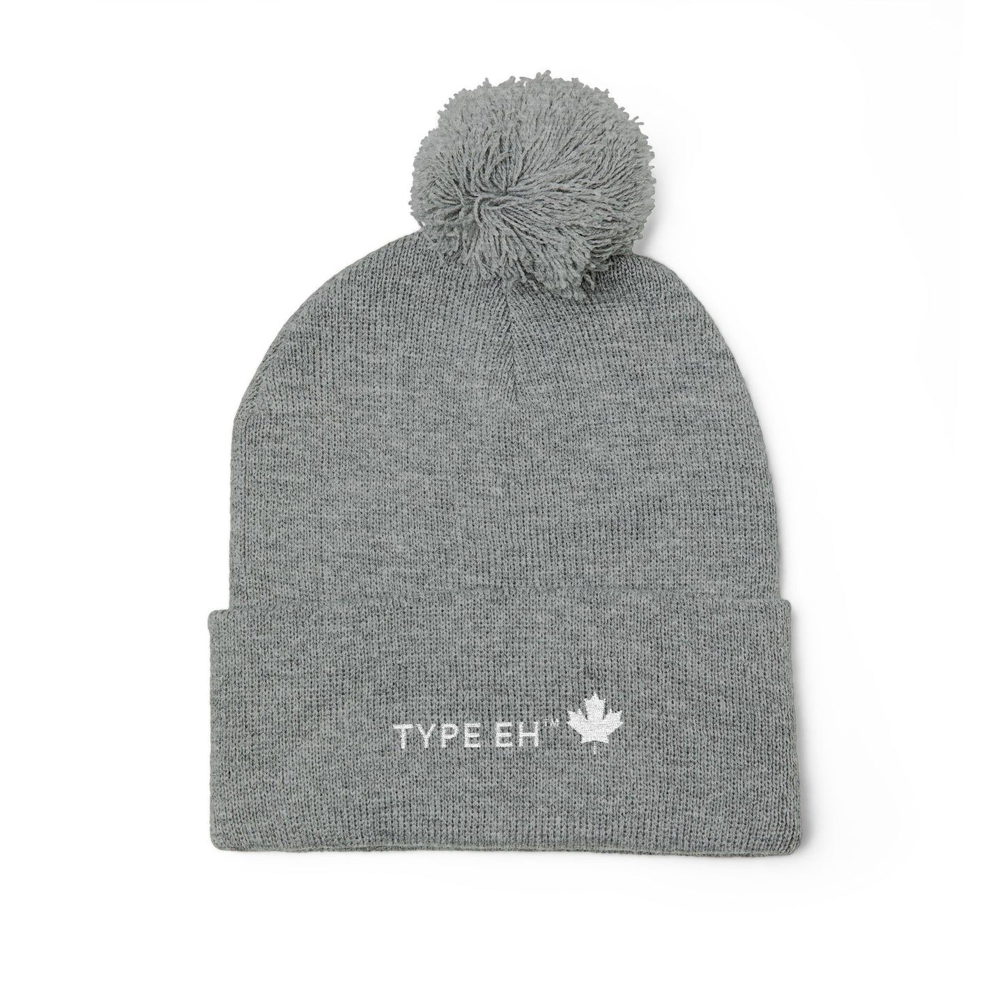 Embroidered Pom-Pom Knit Cap — Cozy Winter Beanie with Subtle Leaf Logo