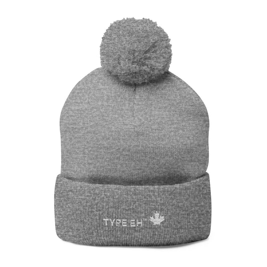 Embroidered Pom-Pom Knit Cap — Cozy Winter Beanie with Subtle Leaf Logo