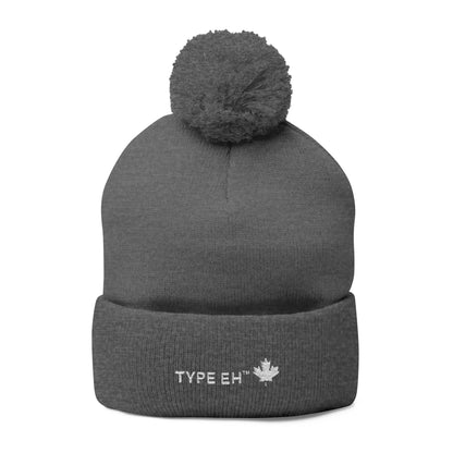 Embroidered Pom-Pom Knit Cap — Cozy Winter Beanie with Subtle Leaf Logo