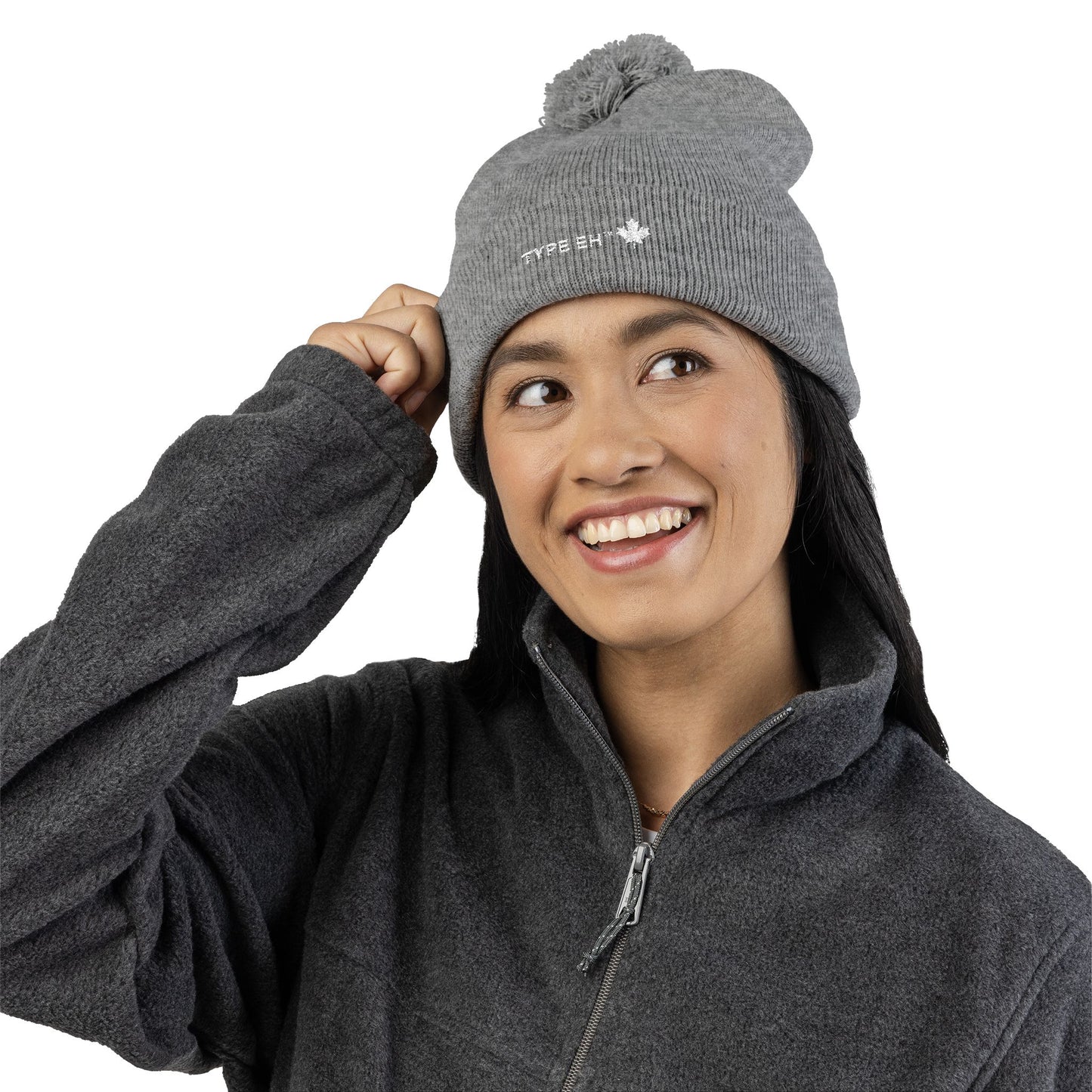 Embroidered Pom-Pom Knit Cap — Cozy Winter Beanie with Subtle Leaf Logo