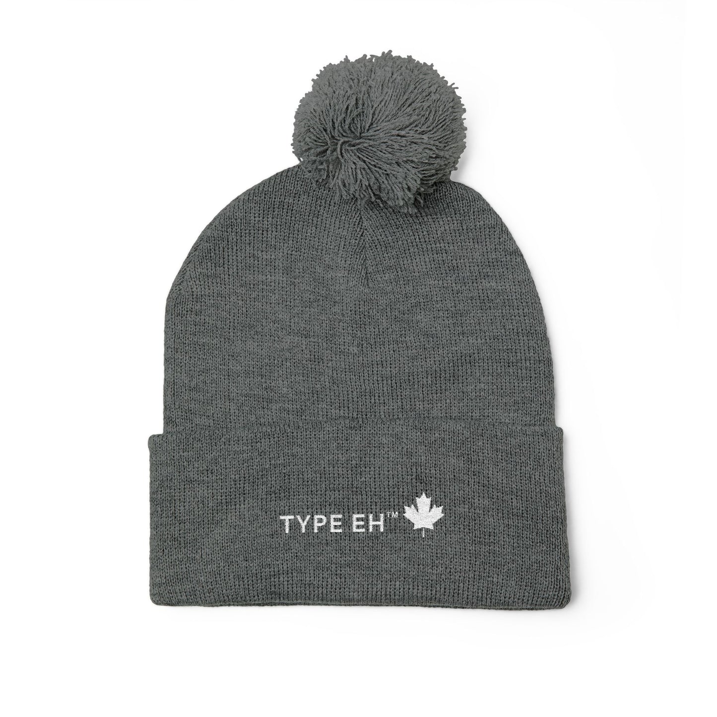 Embroidered Pom-Pom Knit Cap — Cozy Winter Beanie with Subtle Leaf Logo