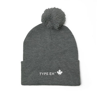 Embroidered Pom-Pom Knit Cap — Cozy Winter Beanie with Subtle Leaf Logo